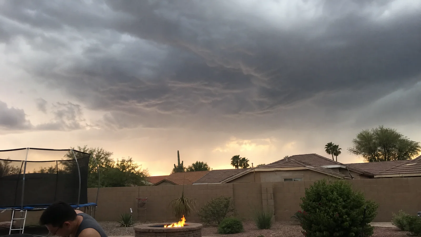 Monsoon storm clouds building over a Phoenix desert neighborhood